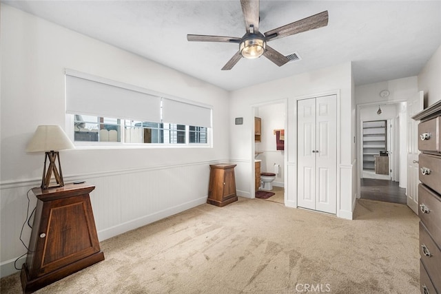 7028 E Parkcrest St, Long Beach, CA 90808 - carpeted bedroom with ensuite bathroom, a closet, and a ceiling fan