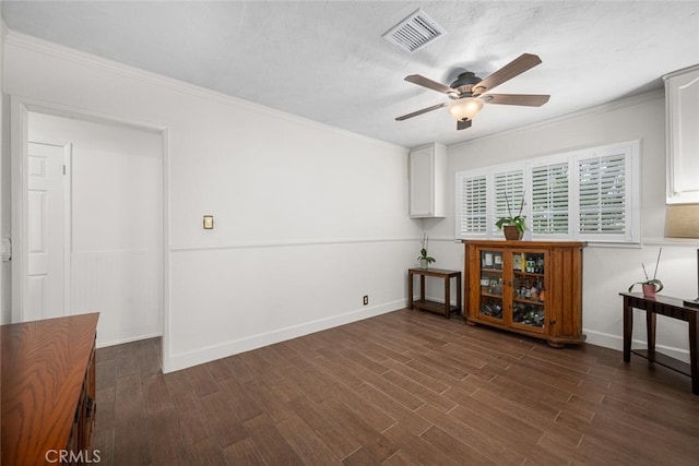 7028 E Parkcrest St, Long Beach, CA 90808 - spare room with ceiling fan, dark wood-type flooring, and ornamental molding
