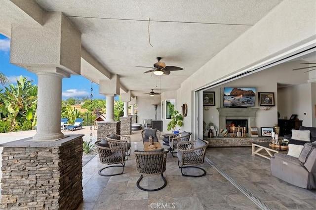17180 Mockingbird Canyon Rd, Riverside, CA 92504 - view of patio featuring a ceiling fan and an outdoor living space with a fireplace