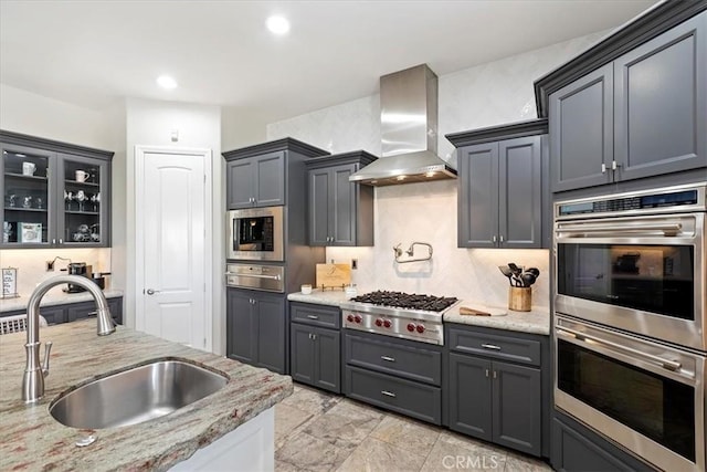17180 Mockingbird Canyon Rd, Riverside, CA 92504 - kitchen featuring stainless steel appliances, island range hood, a warming drawer, decorative backsplash, and light stone counters