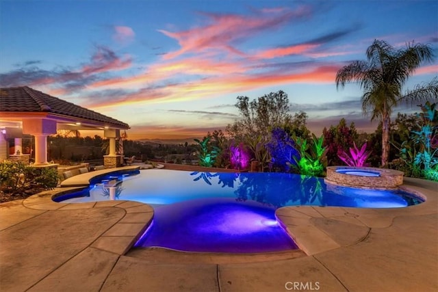17180 Mockingbird Canyon Rd, Riverside, CA 92504 - pool at dusk with a gazebo, a patio, and a pool with connected hot tub