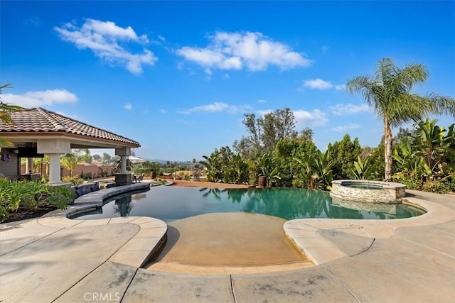 17180 Mockingbird Canyon Rd, Riverside, CA 92504 - view of swimming pool featuring a pool with connected hot tub and a patio