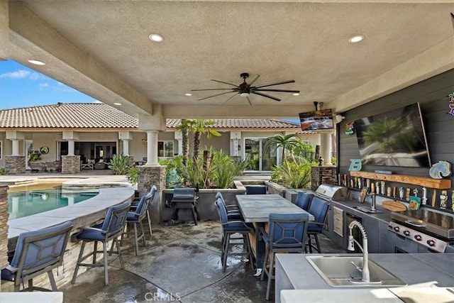 17180 Mockingbird Canyon Rd, Riverside, CA 92504 - view of patio featuring area for grilling, a ceiling fan, a bar, an outdoor pool, and outdoor dining area