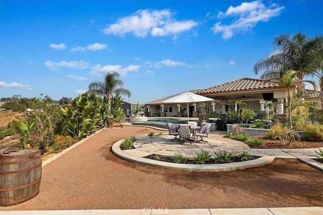 17180 Mockingbird Canyon Rd, Riverside, CA 92504 - view of patio with an outdoor pool and ceiling fan