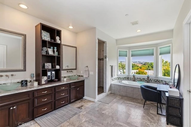 17180 Mockingbird Canyon Rd, Riverside, CA 92504 - full bathroom with double vanity, a garden tub, a shower stall, and recessed lighting