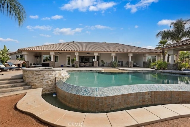 17180 Mockingbird Canyon Rd, Riverside, CA 92504 - view of swimming pool with ceiling fan, an infinity pool, and a patio area