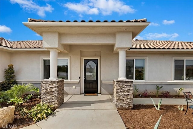 17180 Mockingbird Canyon Rd, Riverside, CA 92504 - entrance to property featuring a tiled roof and stucco siding