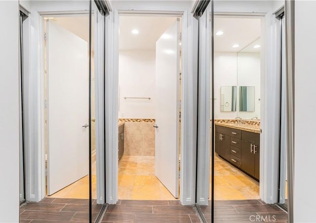 5151 Balboa Blvd Unit 104, Encino, CA 91316 - hall featuring wood tiled floors and a sink