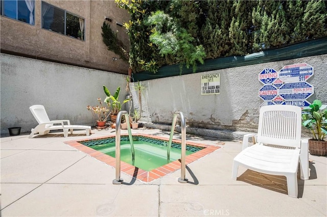 5151 Balboa Blvd Unit 104, Encino, CA 91316 - view of swimming pool featuring a community hot tub and a patio