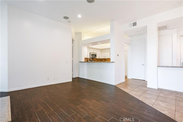 5151 Balboa Blvd Unit 104, Encino, CA 91316 - unfurnished living room featuring wood finished floors and recessed lighting