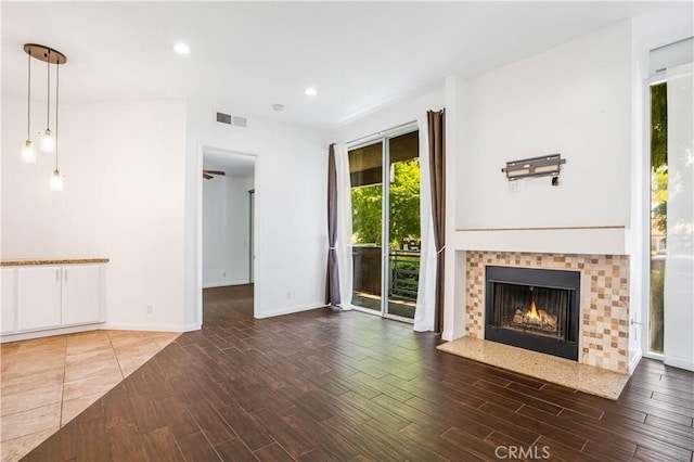 5151 Balboa Blvd Unit 104, Encino, CA 91316 - unfurnished living room with wood finished floors, recessed lighting, and a warm lit fireplace