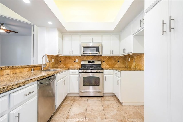 5151 Balboa Blvd Unit 104, Encino, CA 91316 - kitchen with stainless steel appliances, recessed lighting, white cabinets, and backsplash