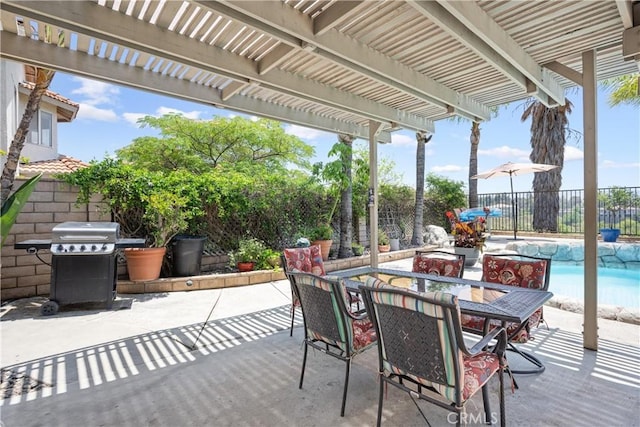 566 Bruin Dr, Riverside, CA 92507 - fenced backyard with area for grilling, a pergola, outdoor dining space, and a patio
