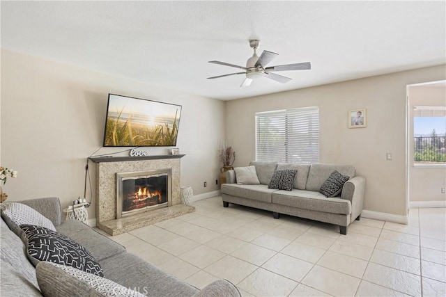 566 Bruin Dr, Riverside, CA 92507 - living area featuring a ceiling fan, light tile patterned flooring, and a fireplace