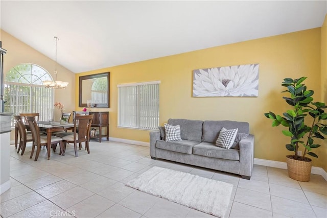 566 Bruin Dr, Riverside, CA 92507 - living room featuring a chandelier, light tile patterned flooring, and lofted ceiling