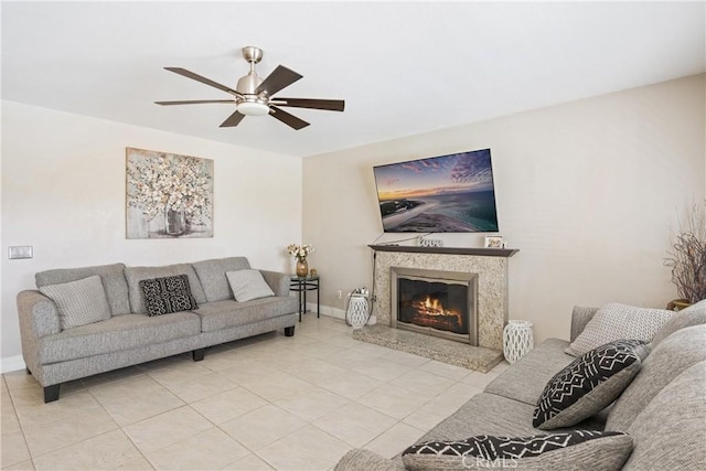 566 Bruin Dr, Riverside, CA 92507 - living room featuring light tile patterned floors, ceiling fan, and a fireplace