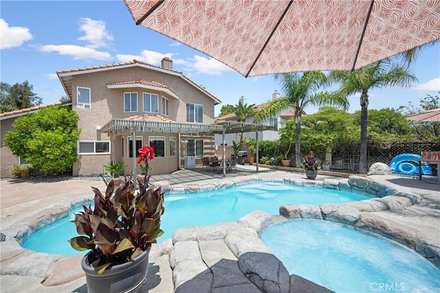566 Bruin Dr, Riverside, CA 92507 - view of swimming pool featuring a pergola, a patio, and a pool with connected hot tub