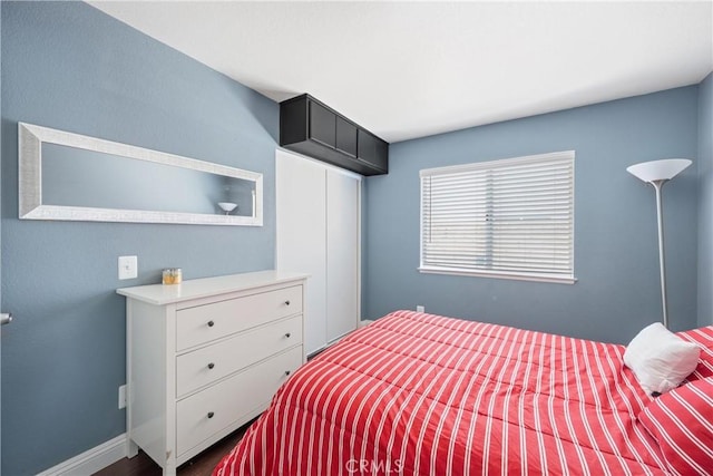 566 Bruin Dr, Riverside, CA 92507 - bedroom with dark wood-type flooring and baseboards