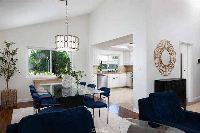 5302 Bryant Cir, Westminster, CA 92683 - dining room featuring light wood finished floors and high vaulted ceiling