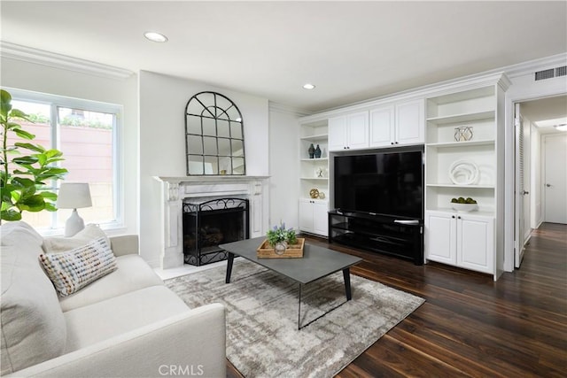 5302 Bryant Cir, Westminster, CA 92683 - living area featuring a high end fireplace, dark wood-style flooring, ornamental molding, and recessed lighting