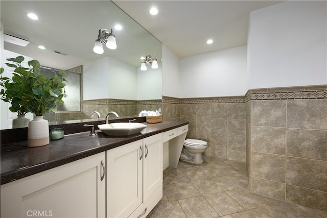 5302 Bryant Cir, Westminster, CA 92683 - bathroom featuring tile walls, vanity, tile patterned flooring, wainscoting, and recessed lighting