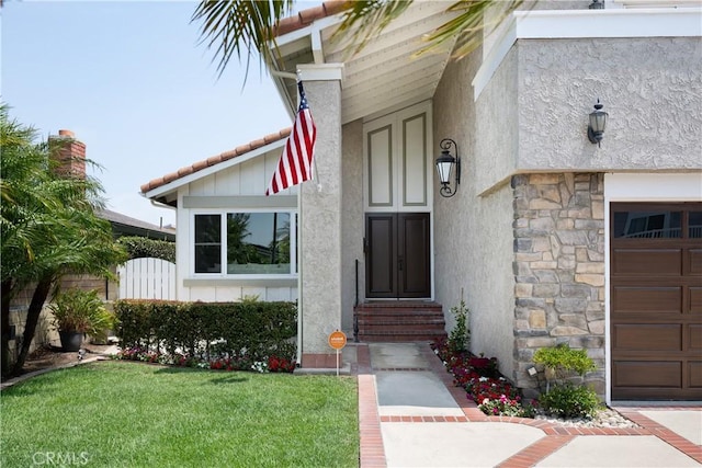 5302 Bryant Cir, Westminster, CA 92683 - property entrance featuring stucco siding, stone siding, and a lawn