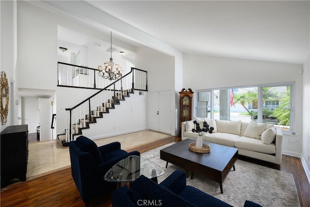 5302 Bryant Cir, Westminster, CA 92683 - living area with high vaulted ceiling, stairway, a chandelier, and wood finished floors