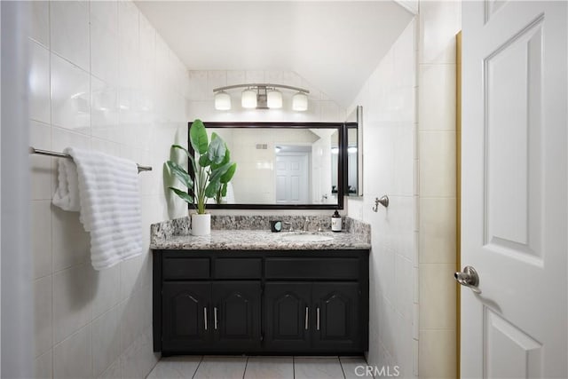 5302 Bryant Cir, Westminster, CA 92683 - bathroom featuring tile walls, vanity, and tile patterned flooring
