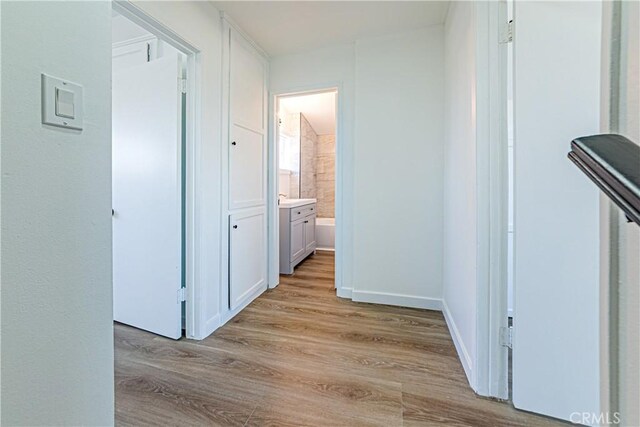 1510 W 147th St, Gardena, CA 90247 - hallway featuring light wood-style floors