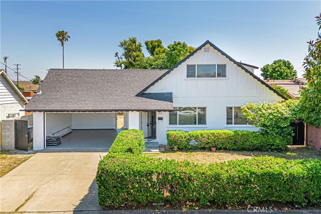 1510 W 147th St, Gardena, CA 90247 - view of front of property featuring board and batten siding, an attached carport, concrete driveway, and roof with shingles