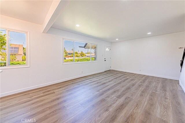 1510 W 147th St, Gardena, CA 90247 - empty room with healthy amount of natural light, wood finished floors, and recessed lighting