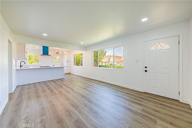 1510 W 147th St, Gardena, CA 90247 - unfurnished living room with recessed lighting and light wood-style flooring