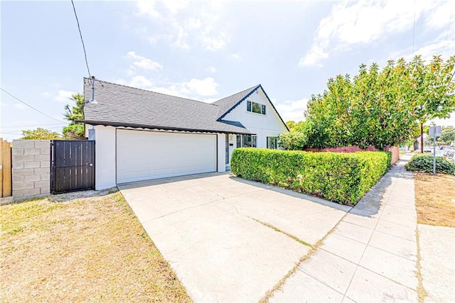 1510 W 147th St, Gardena, CA 90247 - view of front of home featuring driveway, an attached garage, a gate, and roof with shingles