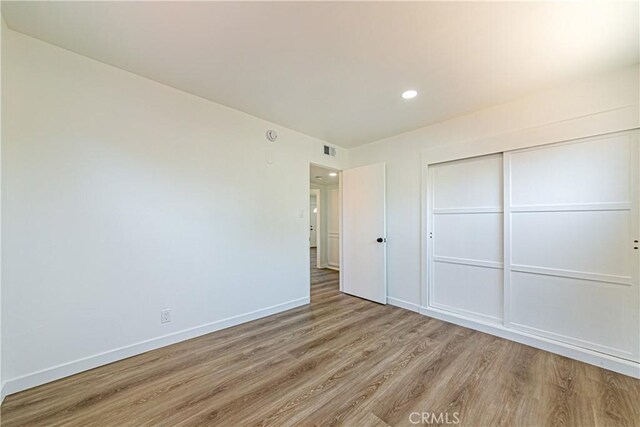 1510 W 147th St, Gardena, CA 90247 - unfurnished bedroom with light wood-style flooring, recessed lighting, and a closet