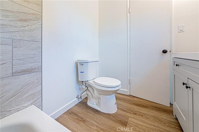 1510 W 147th St, Gardena, CA 90247 - full bathroom featuring wood finished floors and a bathtub