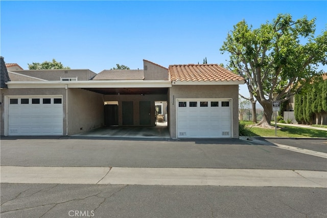 22524 Paseo Terraza, Saugus, CA 91350 - view of front of house featuring stucco siding, a garage, and a tiled roof