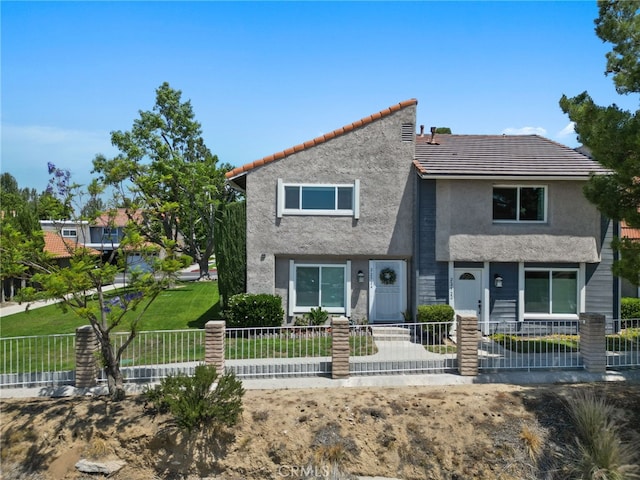 22524 Paseo Terraza, Saugus, CA 91350 - multi unit property featuring a fenced front yard, stucco siding, and a tile roof