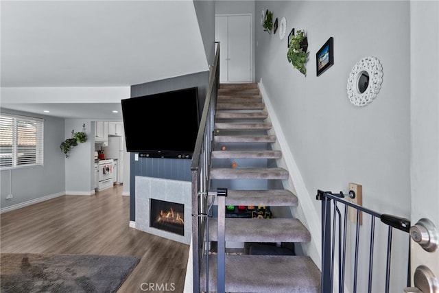 22524 Paseo Terraza, Saugus, CA 91350 - staircase featuring wood finished floors and a tile fireplace