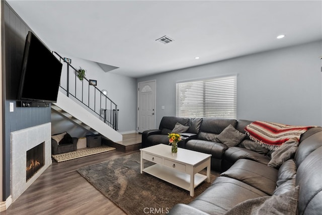 22524 Paseo Terraza, Saugus, CA 91350 - living area featuring stairway, wood finished floors, recessed lighting, and a lit fireplace