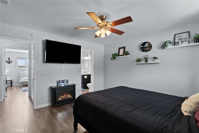 22524 Paseo Terraza, Saugus, CA 91350 - bedroom featuring wood finished floors, ensuite bath, and a ceiling fan