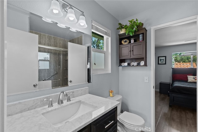 22524 Paseo Terraza, Saugus, CA 91350 - ensuite bathroom with vanity, a tile shower, and wood finished floors