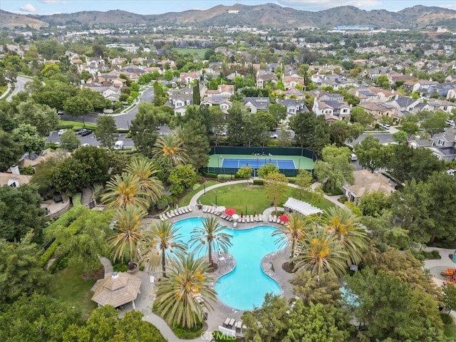 74 Garrison Loop, Ladera Ranch, CA 92694 - aerial view of property's location with a mountainous background and a pool area