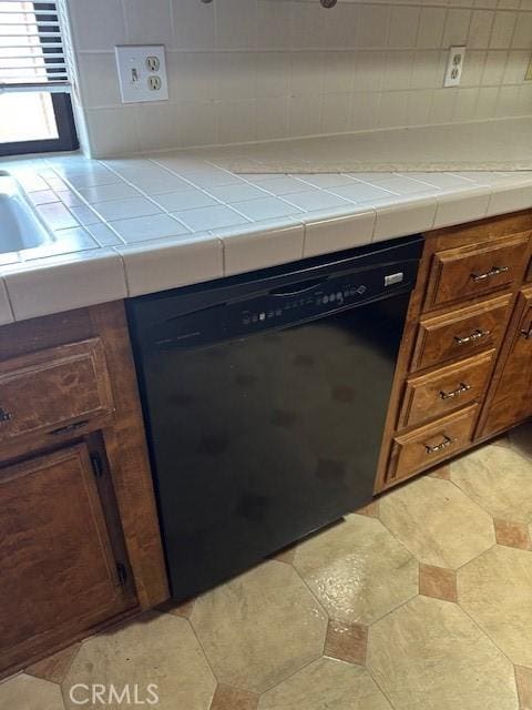 27208 Cornell St, Hemet, CA 92544 - kitchen view of dishwashing machine, decorative backsplash, and tile countertops