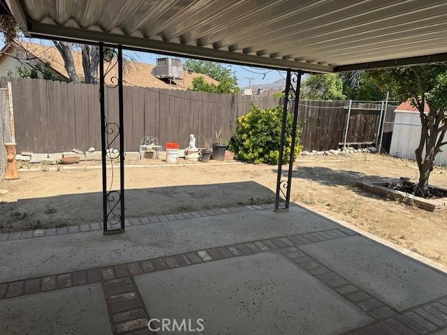 27208 Cornell St, Hemet, CA 92544 - fenced backyard with a patio area and a storage shed