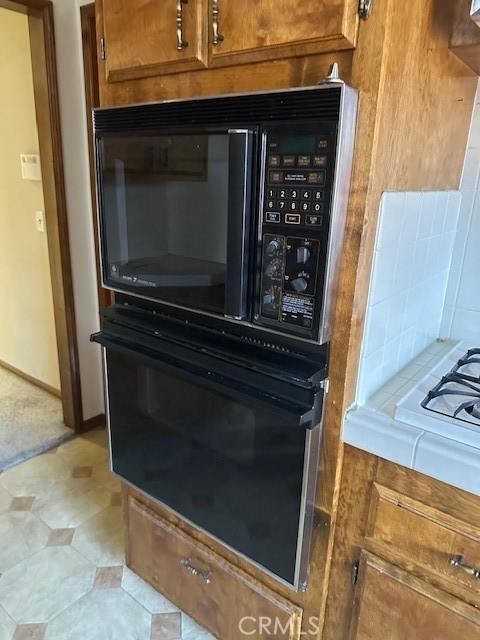 27208 Cornell St, Hemet, CA 92544 - kitchen view of oven and brown cabinetry