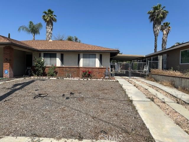 27208 Cornell St, Hemet, CA 92544 - view of front of home featuring brick siding, an attached carport, and driveway