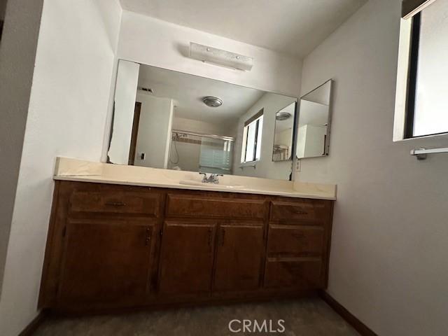 27208 Cornell St, Hemet, CA 92544 - full bathroom featuring vanity and an enclosed shower