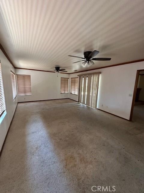 27208 Cornell St, Hemet, CA 92544 - unfurnished living room with crown molding and a ceiling fan