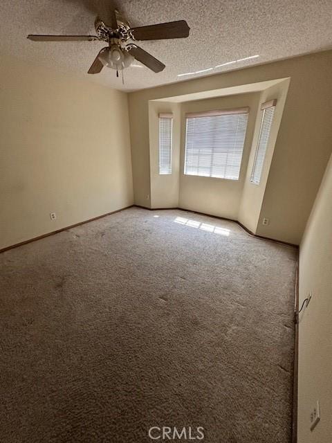 27208 Cornell St, Hemet, CA 92544 - carpeted spare room with a ceiling fan and a textured ceiling