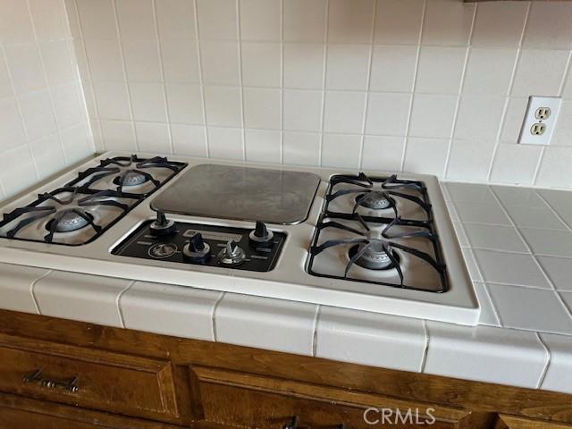 27208 Cornell St, Hemet, CA 92544 - kitchen view of tasteful backsplash and stainless steel gas stovetop